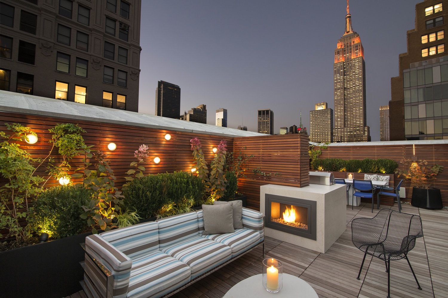 Evening fire glowing on a stylish outdoor terrace